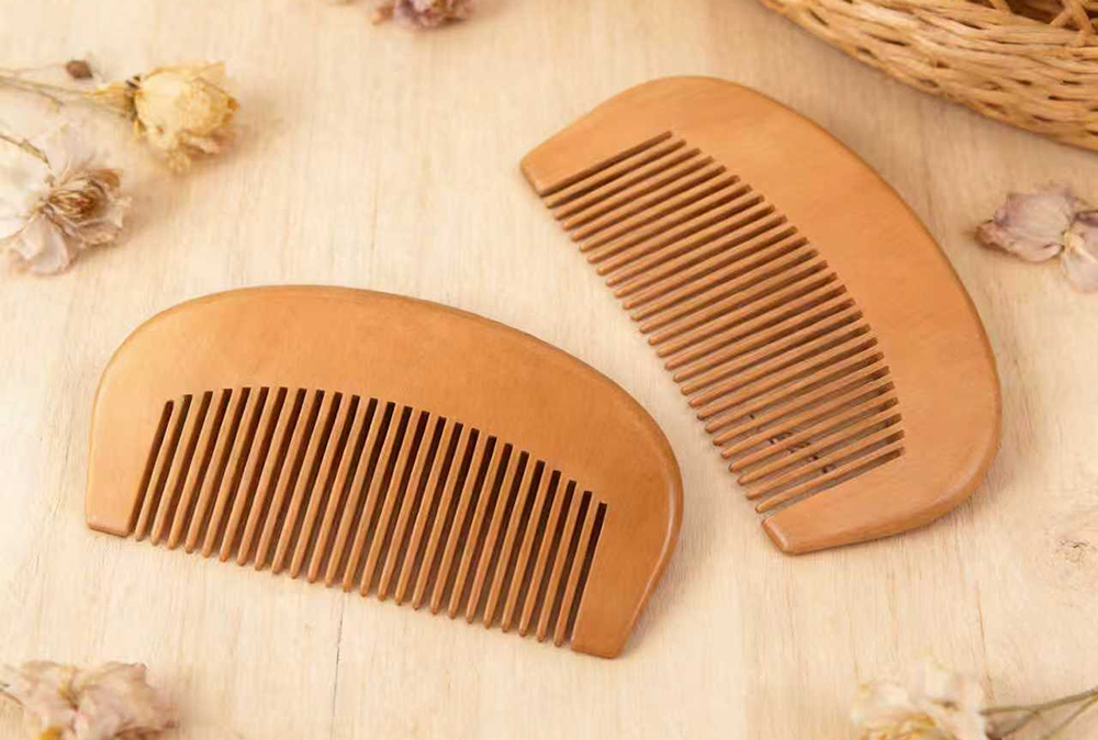 Smooth rounded teeth of crescent wooden hair comb for curly hair