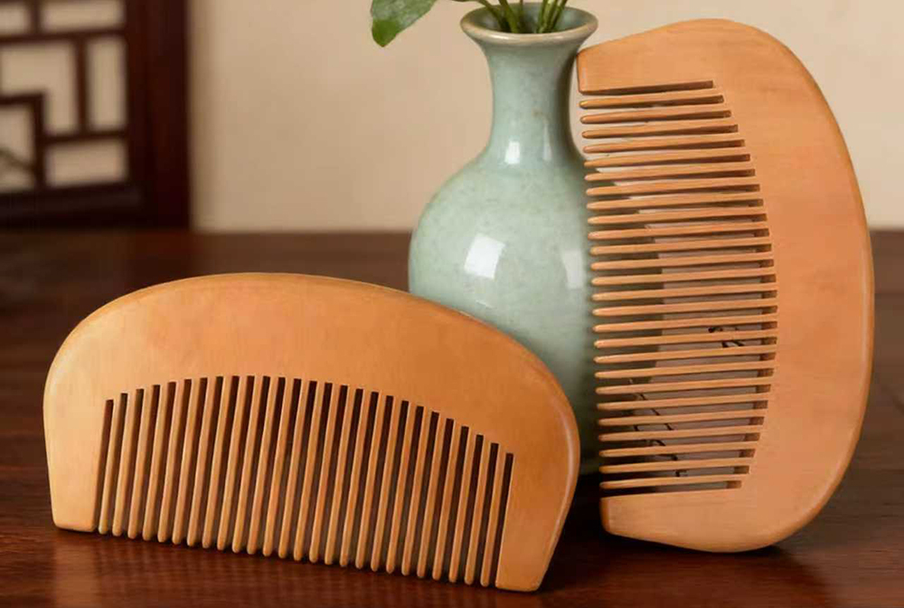 Portable crescent wood comb for travel and zero-waste lifestyle